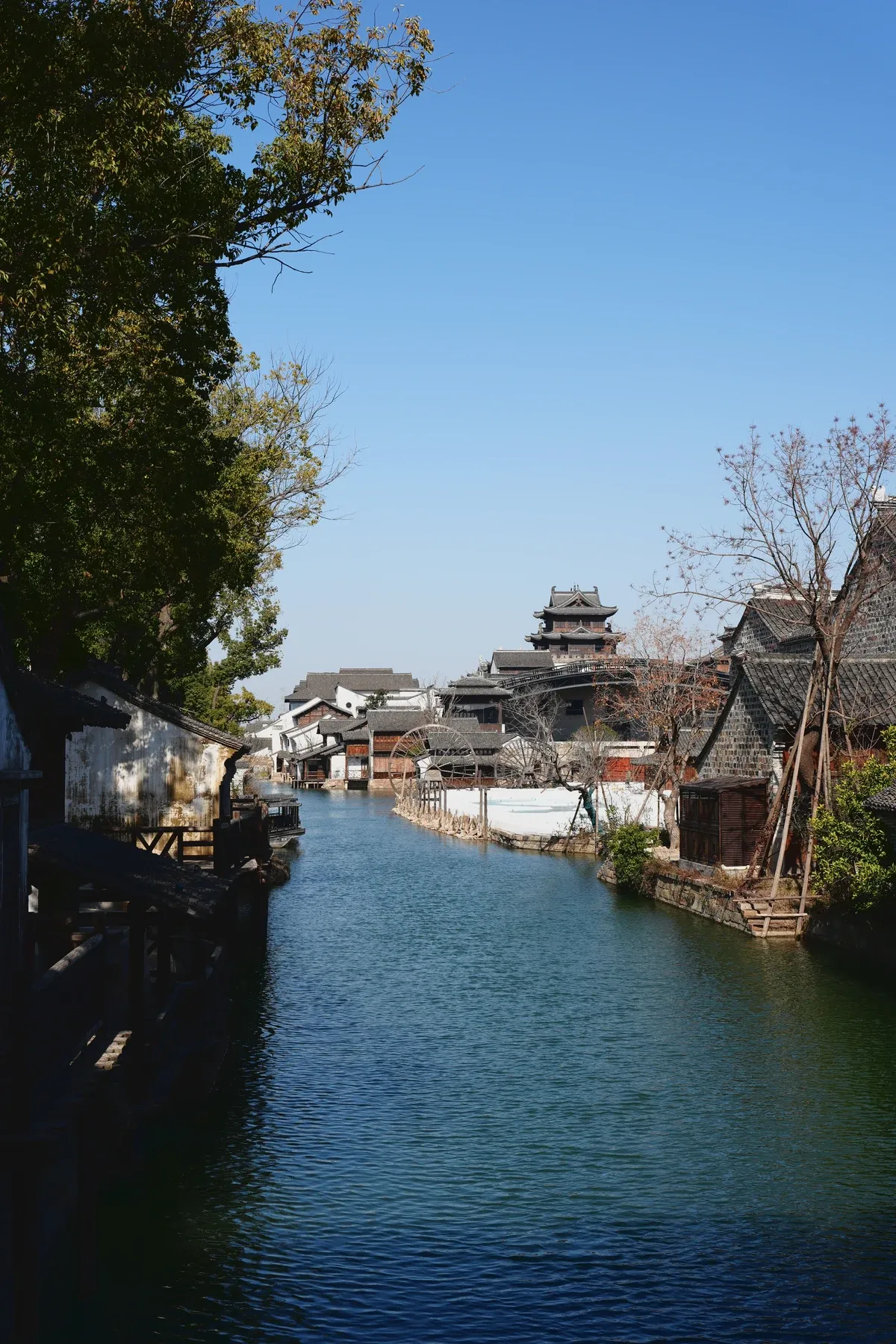 SonyRAWAgent internal test output of the same canal and traditional waterside buildings photograph